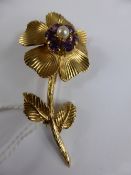 A Lady`s 9ct Hallmark Amethyst 4 mm and Pearl 3 mm Flower Brooch, approx 9.9 gms.