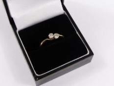 A Lady`s 18 ct Yellow Gold and Platinum Two Stone Diamond Cross Over Ring, Size Q, approx 1.6 gms.