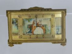 Edwardian boudoir timepiece in rectangular form in a gilt case, the face having Arabic numerals