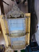 An antique French style wood and plaster wall hanging mirror, the mirror having swags and flowers