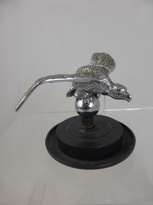 A Chrome Car Mascot, in the form of a bird of prey stamped Tesmo. (?)