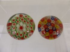 A concentric Milliefori paperweight with red, white and green canes together with another smaller