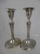 Two solid silver candlesticks, London hallmark dated 1900, maker`s mark TBWBHH, 19 cms high, 540