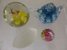 A collections of glass paperweights  including a floral specimen with bubble inclusions and two