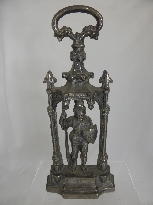 An Antique Cast Iron Doorstop in the form of a knight 45 cms h.