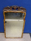 A Chippendale style antique mahogany framed mirror, the mirror having decorations to top depicting