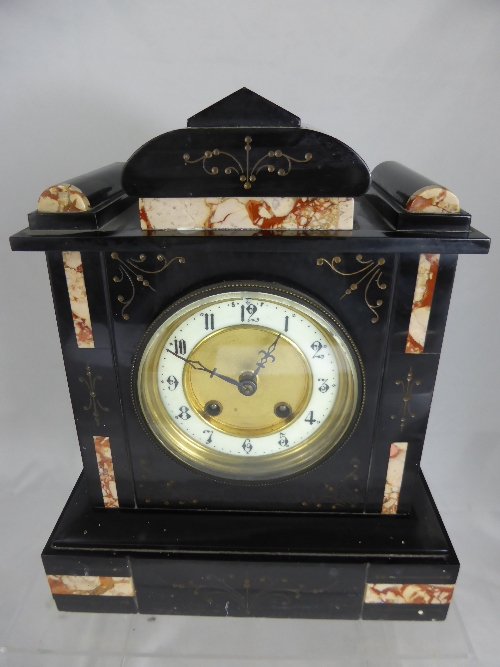 A Victorian Slate Mantle Clock, the clock measuring 25 x 31 x 13 cms.