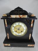 A Victorian Slate Mantle Clock, the clock measuring 25 x 31 x 13 cms.