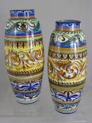 A pair of contemporary Majolica style vases approximately 37 cms high.