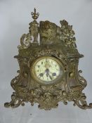 A French Alps Brass Mantle clock, the clock measuring 33 x 35 x 13 cms.