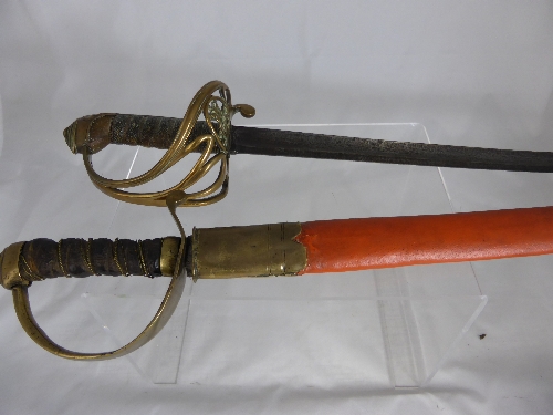 A vintage leather handled cutlass, the cutlass having a wide handle with brass hilt together with