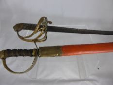 A vintage leather handled cutlass, the cutlass having a wide handle with brass hilt together with