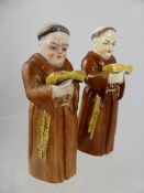 Two Royal Worcester `Monk` Candle Snuff, the first earlier with a puce Royal Worcester factory mark