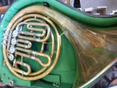 A "" Paxman "" French Horn ( compensating F / Bb ) in a hard case together with some horn music and