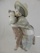 Lladro Porcelain Study, depicting a `Boy and his Donkey`, nr T8.