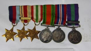 Collection of miniature military war medals comprising 1939-45 Star, Africa Star with Bar, Italy