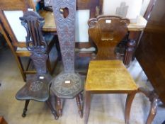 Two Carved Oak Spinning Chairs, decorative carving to seat and backs, supported on turned legs, one