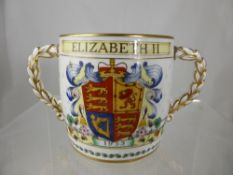 A Foley porcelain Elizabeth II Coronation mug, the double handled mug having gilded handles.