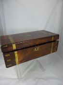 A mahogany antique brass bound Rosewood travelling writing box, 50 x 25 x 18 cms.