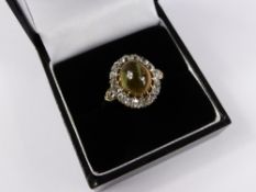 A lady`s 18 carat yellow gold diamond and cat`s eye ring, cat`s eye 5.8 cts, size 0, 4.9 gms.