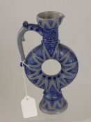 An unusual pottery ewer with blue floral design Nr. 720 impressed marks to base.