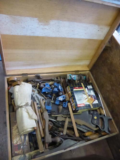 A Tool chest containing many vintage and other hand tools comprising planes, saws, clamps,