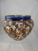 A Royal Doulton and Slaters Lambeth Ware Jardinière, having blue decorated cobalt rim with floral