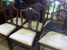 Set of eight antique Hepplewhite style camel back dining chairs, includes two carvers.