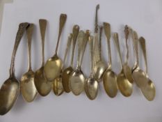 A collection of miscellaneous solid silver and silver metal teaspoons together with miniature button