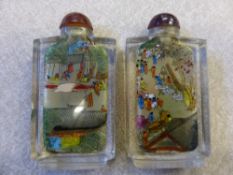 Two Mid 20th Century Chinese interior painted square cut glass snuff bottles with amber coloured