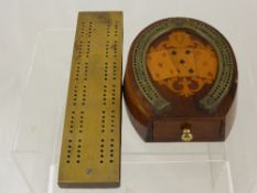 A Rosewood and Mahogany Cribbage board in the form of a horseshoe, the board inlaid with a card