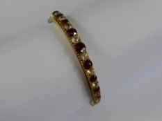 Edwardian 9 ct Yellow Gold Red and White Stone Bangle, approx 12.4 gms