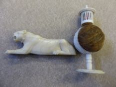 An Oriental pin cushion together with an ivory carving of a lioness (WAF).