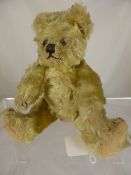 Antique Mohair Teddy Bear, jointed arms and legs with linen padded paws and glass eyes, approx 20