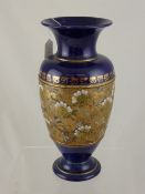 A Royal Doulton Lambeth Ware Vase, the vases gilded with a central band, highlighted with white