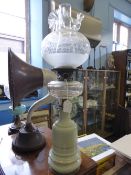 Victorian Glass Oil Lamp, with an olive green reservoir, fluted glass globe with the original