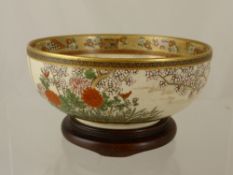 Fine Hand Painted Satsuma Bowl, depicting characters by a lake to the interior with blossom and