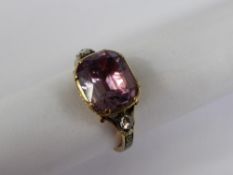 A Georgian 9/14 ct Gold, Amethyst and Diamond Mourning Ring, the ring set with a central amethyst 11