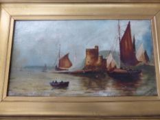 Oil on canvas depicting sailing boats and a castle, signed H G Slater 1917, gilt framed, approx.