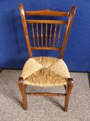 Victorian Mahogany Child`s Nursery Chair, with rush seat and spindle back supports, splayed legs and