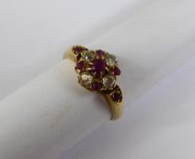 Lady`s 9 / 14 ct (tested) Gold Diamond and Ruby Cluster Ring, size L, the diamonds 4 x 6 pts old