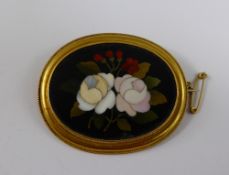 An Italian Continental 9 ct Gilded Mosaic Mourning Brooch, the brooch depicting flowers inscribed