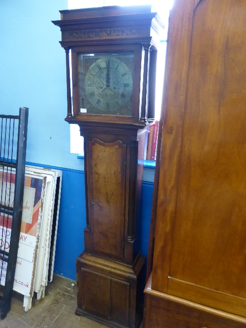 A Georgian oak long case clock, a square glazed door enclosing a 12" brass dial with roman numerals,