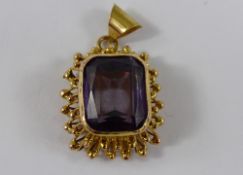 Antique Gold and Amethyst Drop Pendant, the amethyst set in a ornate bead and wire form frame, 12