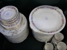 A part porcelain tea set comprising sixteen sandwich plates, cake plate, five coffee cans,