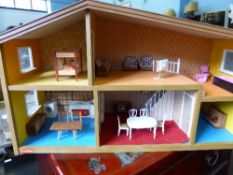 A Vintage Dolls House, together with a quantity of furniture and effects.