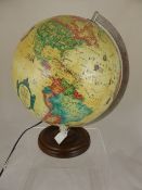 A Readers Digest World Globe, the globe also illuminates together with an instruction book.