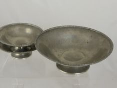 Three Tudric Liberty & Co. English pewter bowls, the hammered finish bowls having wave design to