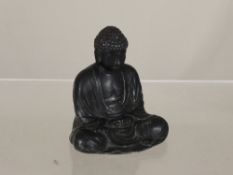 Black Metal Figure of Buddha, seated with Chinese character marks to base.