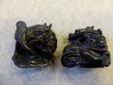 Two Japanese Fruitwood Netsuke depicting dragons.